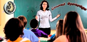 Teacher and student in a classroom at school.