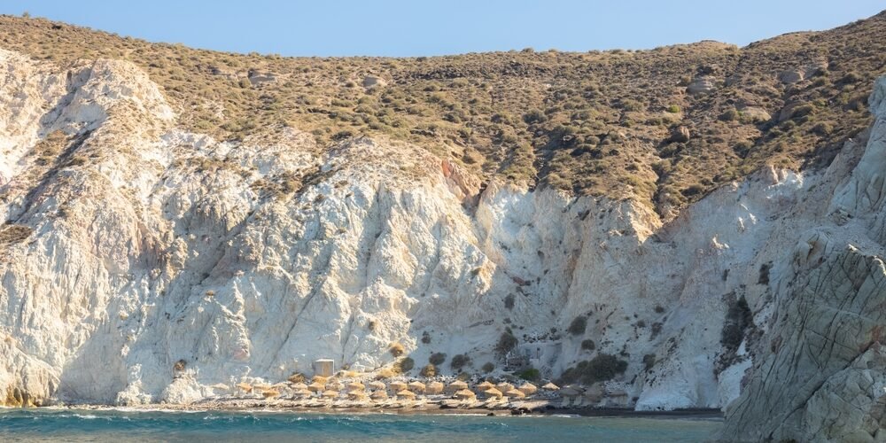 The,Secluded,White,Beach,And,Volcanic,Rock,Formation,Along,The